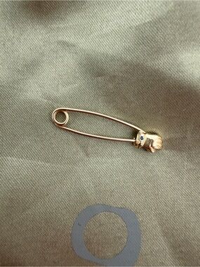 Oxbow Gold Safety Pin with hand and sapphire